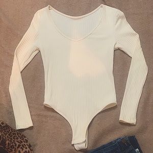 Cream colored body suit